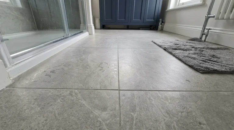 Large porcelain tiles on a UK bathroom floor in natural light.